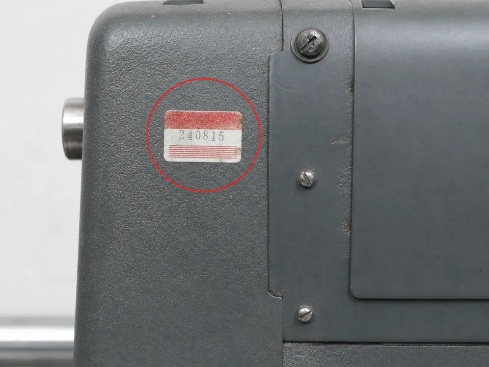 Red and white date-code sticker location on the headstock
